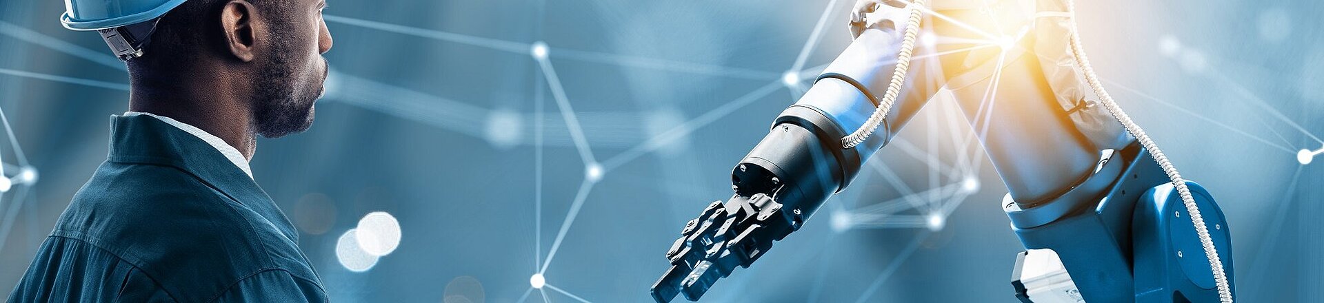 Kendrion robotic arm with colloborater and glow on the right. Blue background with white lines.